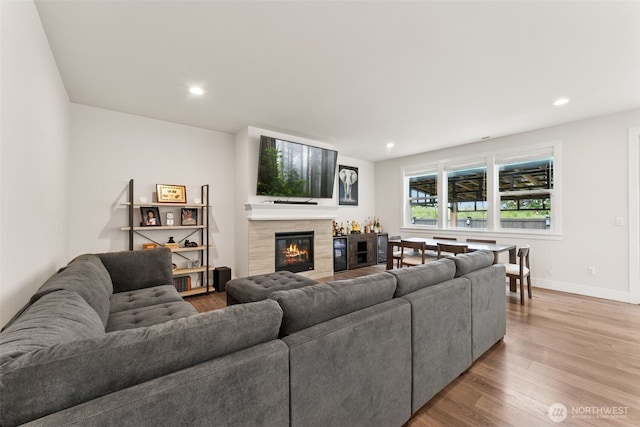 14717 73rd St E, Sumner, WA 98390 - living area featuring light wood-style flooring, a fireplace, and recessed lighting