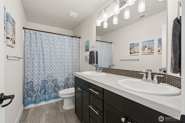 14717 73rd St E, Sumner, WA 98390 - bathroom featuring double vanity, tasteful backsplash, and a shower with curtain