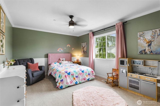 1818 Fisher Ave, Dupont, WA 98327 - bedroom featuring crown molding, carpet flooring, a ceiling fan, and a wainscoted wall