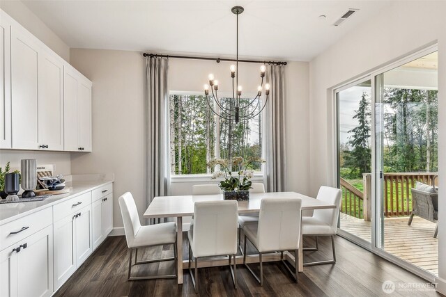 10527 134th Ave NE Unit 103, Lake Stevens, WA 98258 - dining space featuring a chandelier, healthy amount of natural light, and dark wood-type flooring