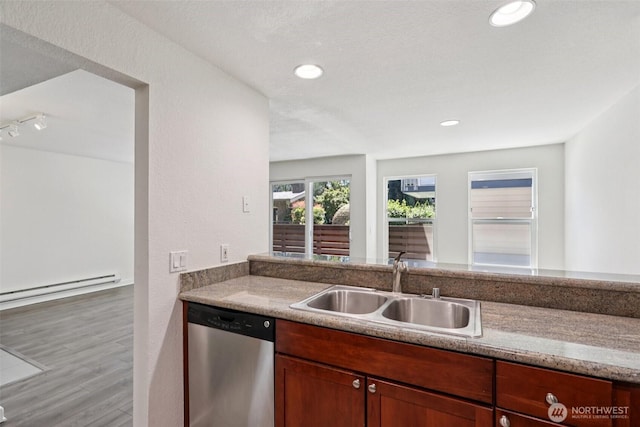 1311 12th Ave S Unit G101, Seattle, WA 98144 - kitchen with dishwasher, wood finished floors, baseboard heating, and recessed lighting