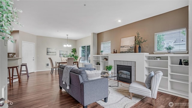 2104 Palisade Blvd Unit B-7, Dupont, WA 98327 - living room featuring dark wood-style flooring, a chandelier, a fireplace, and recessed lighting