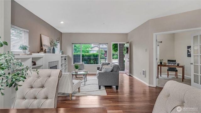 2104 Palisade Blvd Unit B-7, Dupont, WA 98327 - living room with wood finished floors, a fireplace, and recessed lighting