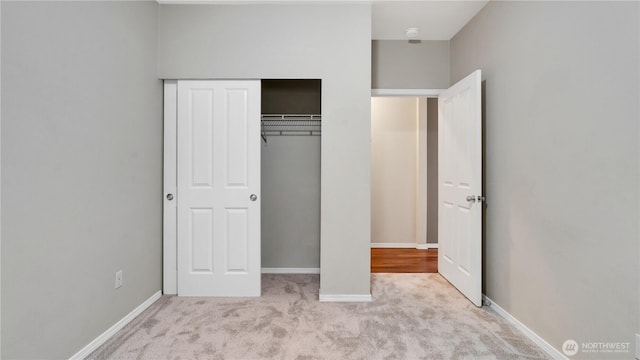 2104 Palisade Blvd Unit B-7, Dupont, WA 98327 - unfurnished bedroom featuring carpet floors and a closet