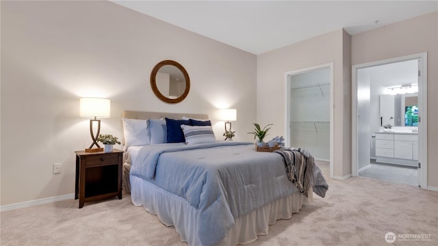 2104 Palisade Blvd Unit B-7, Dupont, WA 98327 - bedroom with light colored carpet, a walk in closet, a closet, and connected bathroom
