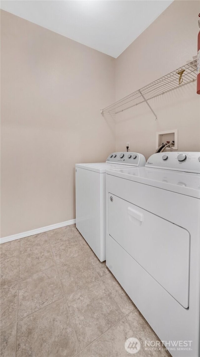 2104 Palisade Blvd Unit B-7, Dupont, WA 98327 - washroom with washing machine and dryer and light tile patterned floors