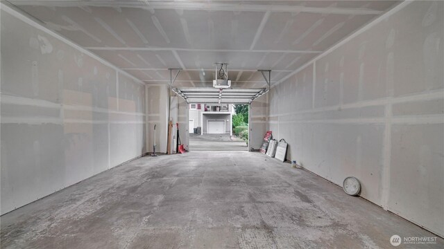 2104 Palisade Blvd Unit B-7, Dupont, WA 98327 - garage featuring a garage door opener