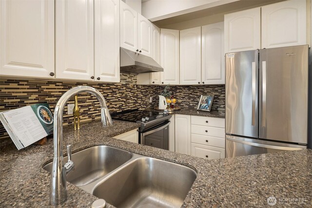 2840 139th Ave SE Unit 16, Bellevue, WA 98005 - kitchen featuring appliances with stainless steel finishes, under cabinet range hood, white cabinets, and tasteful backsplash