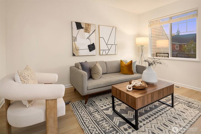 2840 139th Ave SE Unit 16, Bellevue, WA 98005 - living room featuring baseboards and light wood-type flooring