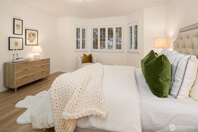2840 139th Ave SE Unit 16, Bellevue, WA 98005 - bedroom with light wood-type flooring and baseboards