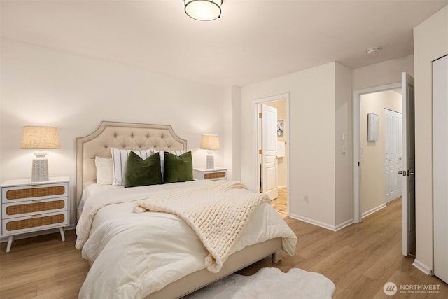 2840 139th Ave SE Unit 16, Bellevue, WA 98005 - bedroom featuring light wood-type flooring and ensuite bath