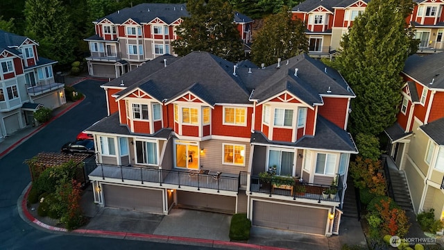2840 139th Ave SE Unit 16, Bellevue, WA 98005 - view of front facade with a garage, driveway, a shingled roof, and a residential view
