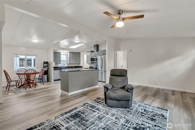 22111 108th Ave SE Unit 5, Kent, WA 98031 - sitting room with light wood-style floors and ceiling fan