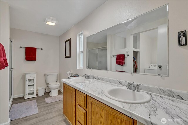 22111 108th Ave SE Unit 5, Kent, WA 98031 - bathroom featuring a stall shower, wood finished floors, and double vanity