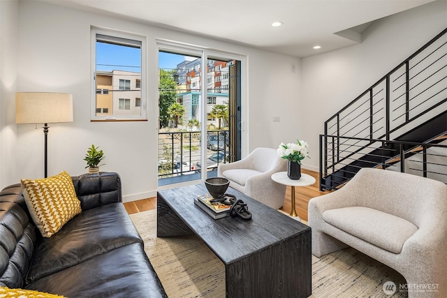 2419 NW 57th Unit B, Seattle, WA 98107 - living room featuring stairway, healthy amount of natural light, wood finished floors, and recessed lighting