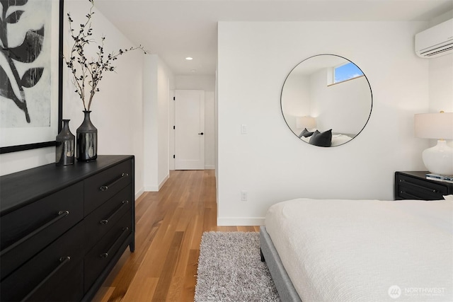 2419 NW 57th Unit B, Seattle, WA 98107 - bedroom with light wood-type flooring, a wall mounted air conditioner, and recessed lighting