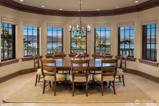 678 Primrose Ln, Friday Harbor, WA 98250 - dining space with light tile patterned floors, a water view, a chandelier, recessed lighting, and crown molding