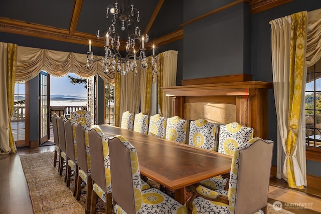 678 Primrose Ln, Friday Harbor, WA 98250 - dining space with a chandelier, wood finished floors, and crown molding