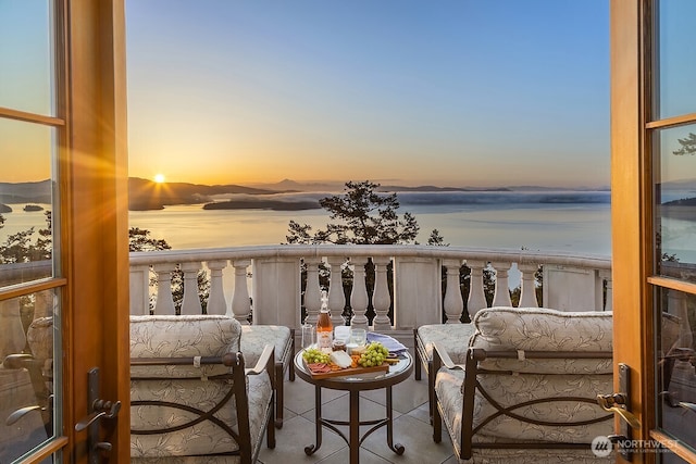 678 Primrose Ln, Friday Harbor, WA 98250 - balcony at dusk featuring a water view