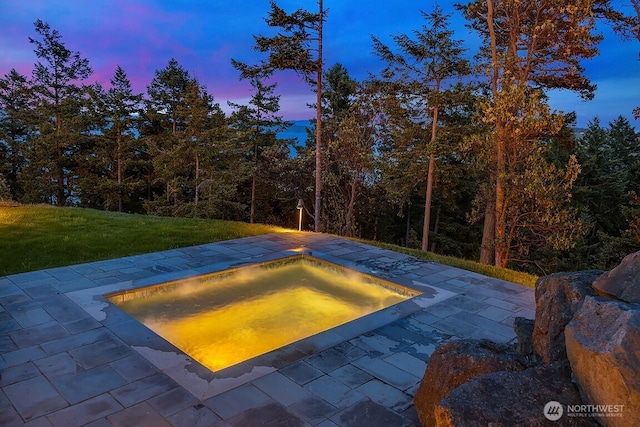 678 Primrose Ln, Friday Harbor, WA 98250 - pool at dusk featuring a lawn and a patio area