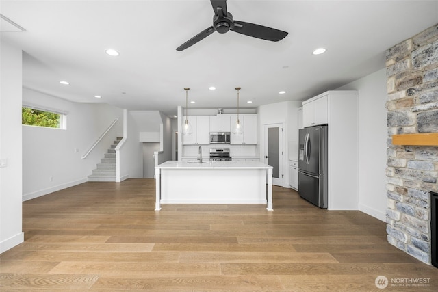 9 160th St SE, Bothell, WA 98012 - kitchen featuring appliances with stainless steel finishes, a ceiling fan, white cabinets, recessed lighting, and light countertops