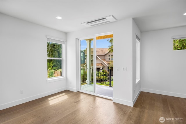 9 160th St SE, Bothell, WA 98012 - spare room with wood finished floors and recessed lighting