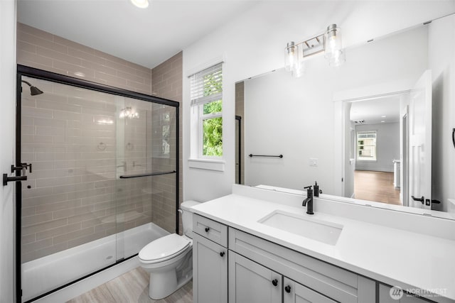9 160th St SE, Bothell, WA 98012 - bathroom with a stall shower, vanity, and wood finished floors
