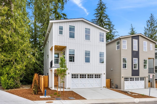 9 160th St SE, Bothell, WA 98012 - view of front of property featuring board and batten siding, an attached garage, and concrete driveway