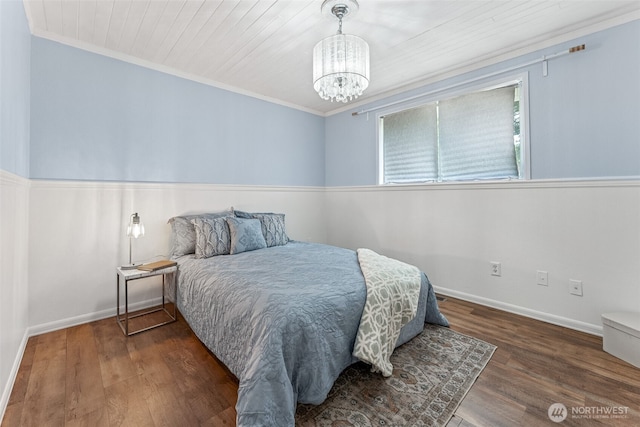 15627 SE 263rd Pl, Covington, WA 98042 - bedroom featuring wood finished floors, a chandelier, and crown molding
