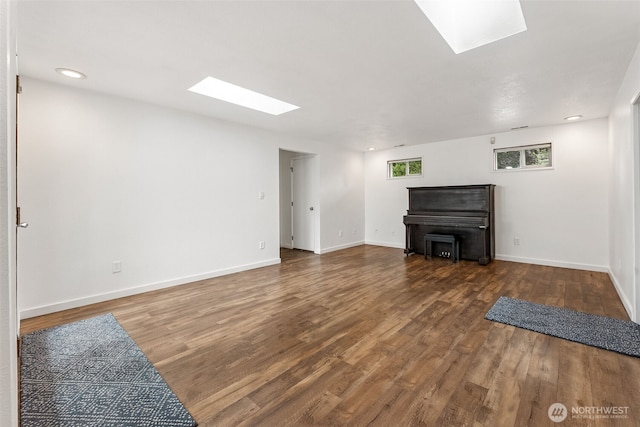 15627 SE 263rd Pl, Covington, WA 98042 - unfurnished living room with a skylight, wood finished floors, and recessed lighting
