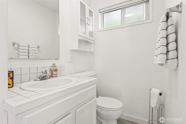 15627 SE 263rd Pl, Covington, WA 98042 - bathroom featuring vanity and decorative backsplash