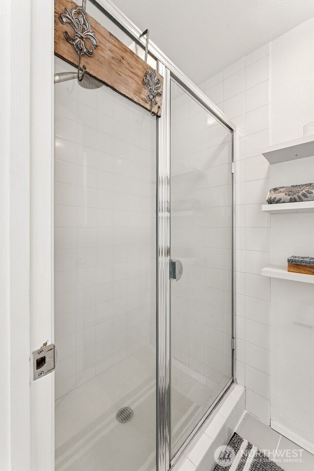 15627 SE 263rd Pl, Covington, WA 98042 - full bath with a shower stall and tile patterned floors