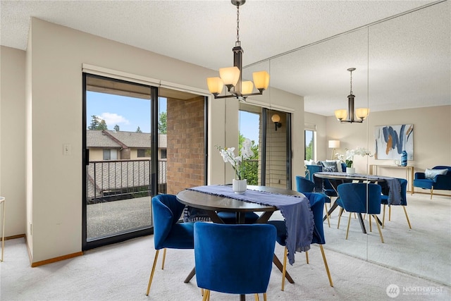 10637 Glen Acres Dr S Unit 10637, Seattle, WA 98168 - dining space with a chandelier, light colored carpet, and a textured ceiling