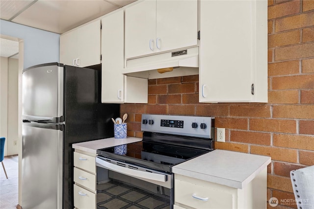 10637 Glen Acres Dr S Unit 10637, Seattle, WA 98168 - kitchen featuring appliances with stainless steel finishes, under cabinet range hood, light countertops, and white cabinets