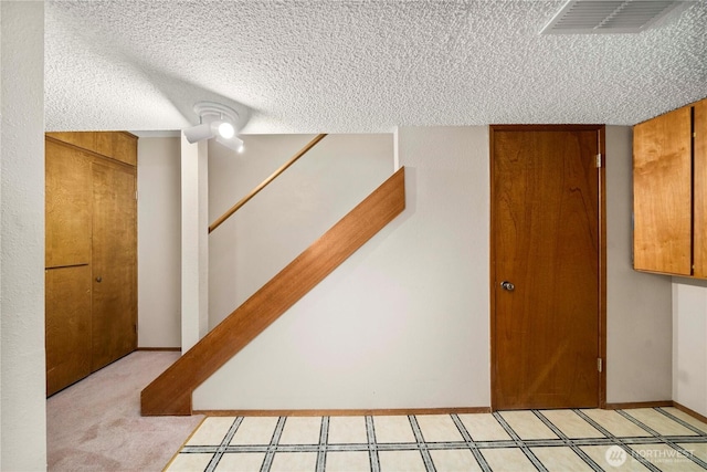 10637 Glen Acres Dr S Unit 10637, Seattle, WA 98168 - finished below grade area with a textured ceiling and stairway