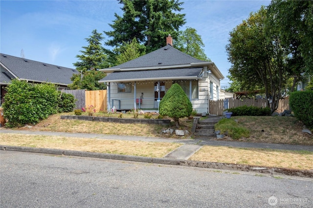 1109 S 61st St, Tacoma, WA 98408 - view of front of house featuring covered porch and a chimney