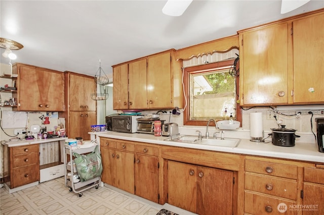 1109 S 61st St, Tacoma, WA 98408 - kitchen featuring light countertops, light flooring, black microwave, open shelves, and brown cabinets