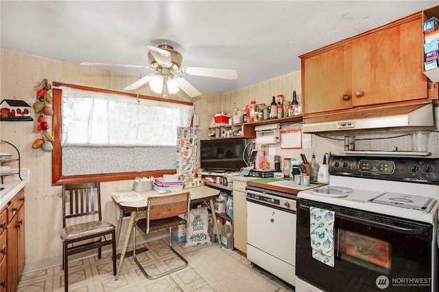 1109 S 61st St, Tacoma, WA 98408 - kitchen featuring electric stove, under cabinet range hood, ceiling fan, light floors, and white dishwasher