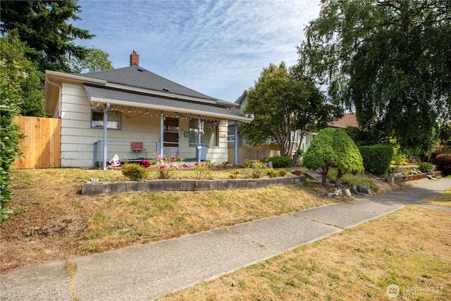 1109 S 61st St, Tacoma, WA 98408 - bungalow featuring a chimney and covered porch