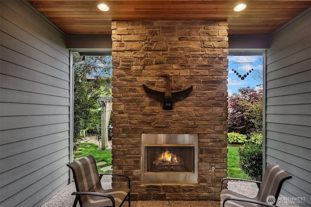 19501 58th Ave SE, Bothell, WA 98012 - view of patio / terrace with an outdoor stone fireplace
