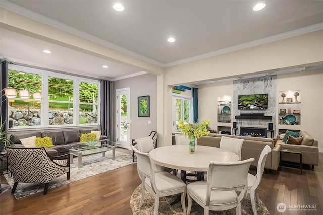 19501 58th Ave SE, Bothell, WA 98012 - dining space featuring ornamental molding, a fireplace, dark wood-style flooring, and recessed lighting