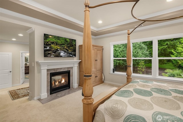 19501 58th Ave SE, Bothell, WA 98012 - bedroom featuring light carpet, a tiled fireplace, crown molding, and recessed lighting