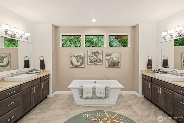19501 58th Ave SE, Bothell, WA 98012 - bathroom featuring two vanities and a freestanding bath