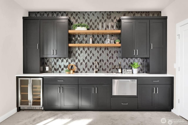 5412 Lonicera Dr, Blaine, WA 98230 - indoor wet bar with beverage cooler, dishwasher, light carpet, and tasteful backsplash