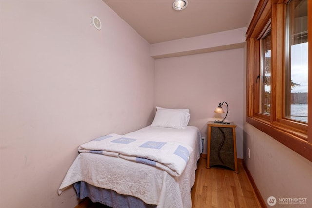 11261 E State Route 106, Union, WA 98592 - bedroom featuring wood finished floors and baseboards