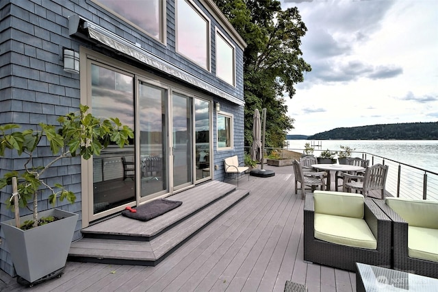 11261 E State Route 106, Union, WA 98592 - wooden deck with a water view and outdoor dining space