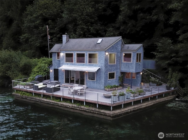 11261 E State Route 106, Union, WA 98592 - rear view of house featuring a chimney, a water view, and a forest view