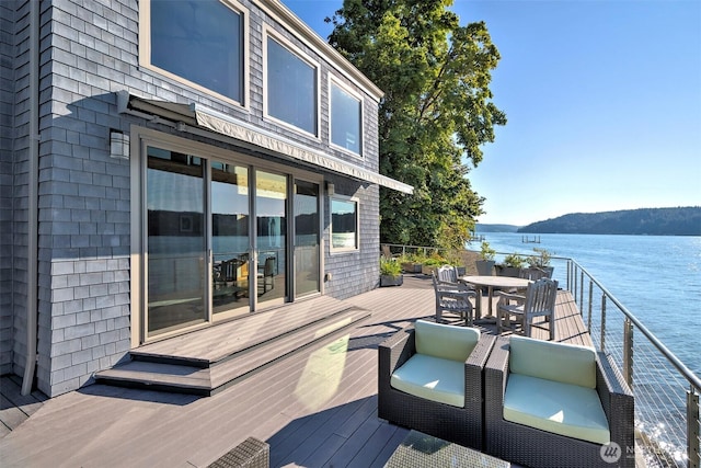 11261 E State Route 106, Union, WA 98592 - wooden deck featuring a water view and outdoor dining area