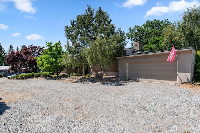 1714 N Astor Ct, East Wenatchee, WA 98802 - view of property hidden behind natural elements featuring a chimney