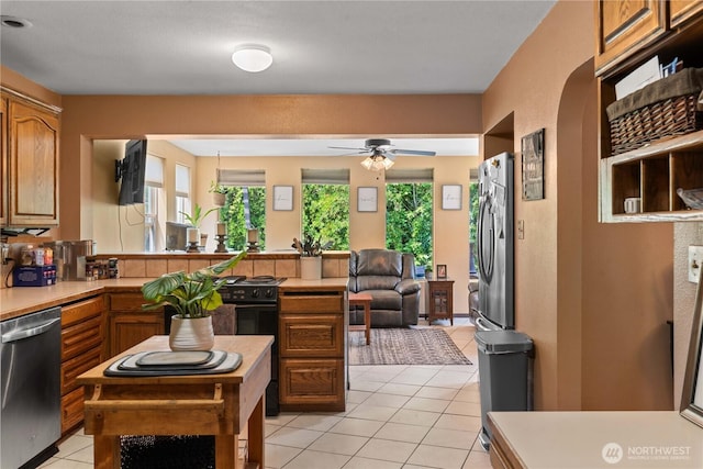 1714 N Astor Ct, East Wenatchee, WA 98802 - kitchen featuring stainless steel appliances, a peninsula, plenty of natural light, and light countertops